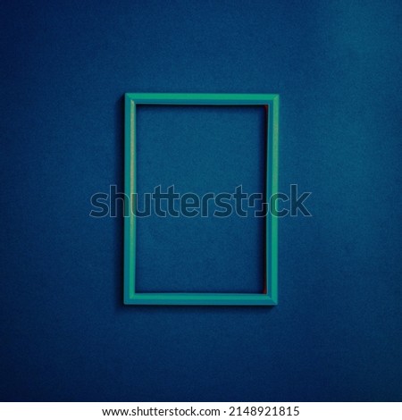 Frame on a blue background. Flat lay concept.