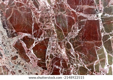 Red granite texture with white and gray lines