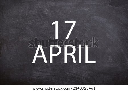 17 April text with blackboard background for calendar. And april is the fourth month of the year