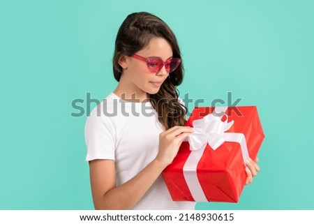 curious kid open present. child prepare for holiday. happy valentines day.