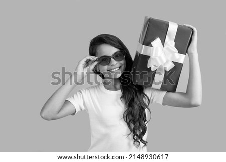 fashionable happy teen girl in sunglasses hold gift box, bday