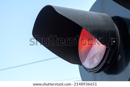 Rail crossing red warning light, train crossing railroad station safety signal light object detail, closeup, nobody no people. Simple rail transportation safety symbol abstract concept, rail transport Royalty-Free Stock Photo #2148936651