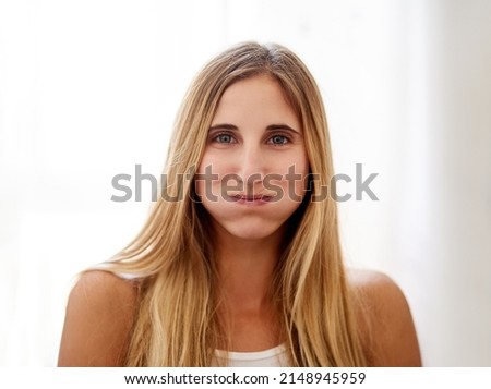 Thirty seconds closer to healthy gums. Portrait of a young woman rinsing her mouth with mouthwash at home. Royalty-Free Stock Photo #2148945959