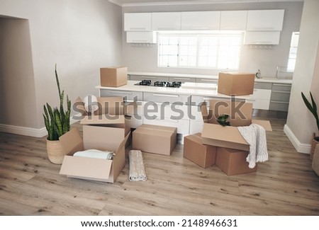 Make it your own. Shot of a room full of boxes waiting to be unpacked on moving day. Royalty-Free Stock Photo #2148946631