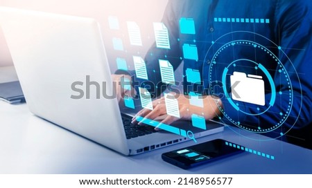 Businessman look up documents and sort items for efficiency.,Systematic search document information concept. Royalty-Free Stock Photo #2148956577