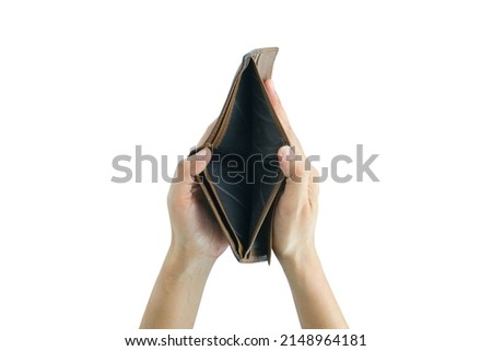 The man opened his brown wallet with no money in his pocket. He was in need, did not have enough money to spend, and was in debt. Royalty-Free Stock Photo #2148964181