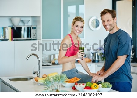 Take your health into your own hands. Portrait of a couple preparing a nutritious meal together at home. Royalty-Free Stock Photo #2148982197