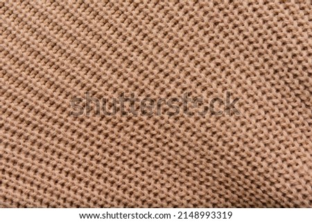Brown clean texture. close up wool sweater texture

