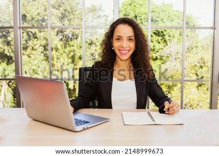 Office work lady : Profile headshot portrait happy hipster smiling beautiful happy looking at camera good mood taking pictures sitting at work software programmers show confidence on office desk.
