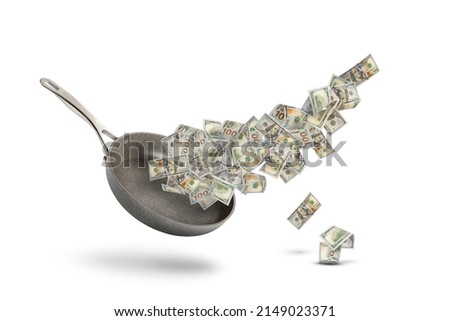 Rising food prices. The concept of rising cost of food. Money in a pot. Dollar bills fly over a frying pan as a symbol of money or salary for food on a white background.