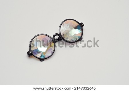 designer kaleidoscope glasses on white background