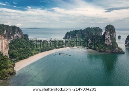 Aerial view of Railay bay beach. Railay, also known as Rai Leh, is a small peninsula between the city of Krabi and Ao Nang in Thailand. It is accessible only by boat due to high limestone.