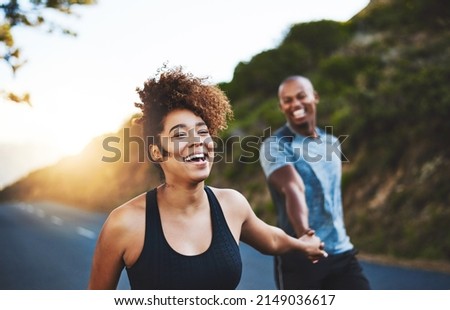 Exercising will only make you feel better. Cropped shot of a happy young couple out for a run together. Royalty-Free Stock Photo #2149036617