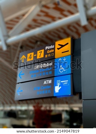Gate, Difable Elevator and ATM center direction on a airport sign in indonesia