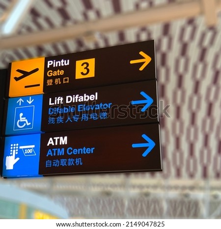 Gate, Difable Elevator and ATM center direction on a airport sign in indonesia