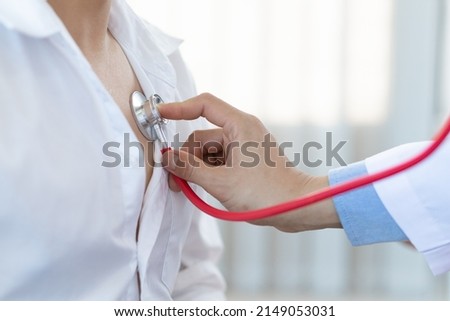 Health care concept medical and diagnosis. Close up doctor using stethoscope physical examination of the patient listening to the respiratory system and lungs. Royalty-Free Stock Photo #2149053031