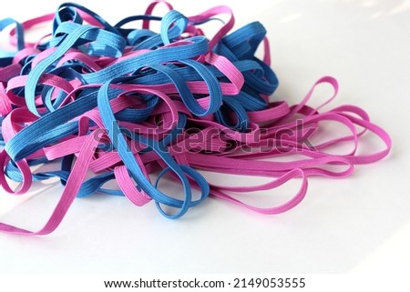  Colored elastic band for clothes on white background.