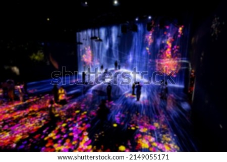 Blurred Digital Arts being exhibited at augmented reality and virtual reality themed museum where visitor can be a part of arts. Abstract and Colorful concept. Royalty-Free Stock Photo #2149055171