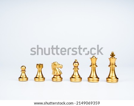 Set of luxury golden chess pieces isolated on white background. The photo of gold chess, king, rook, bishop, queen, knight, and pawn. Royalty-Free Stock Photo #2149069359