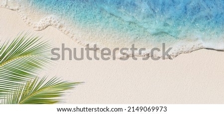Tropical beach background with sea waves, white sand and foam - summer holiday panoramic top view background. Travel and beach vacation, copy space for text.