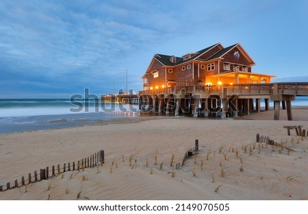 Jennette's Pier after sunset, Nags Head North Carolina. Originally built in 1939, Jennette’s is the oldest fishing pier on the Outer Banks, NC USA Royalty-Free Stock Photo #2149070505