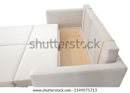 Sofa isolated on white background. Opened storage for bed linen. Including clipping path.