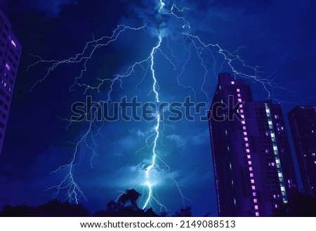 Pop Art Surreal Style of Incredible Lightning Strikes in Cobalt Blue Urban Night Sky