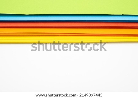 Abstract background with rainbow colored paper, rich shades, close up, white background