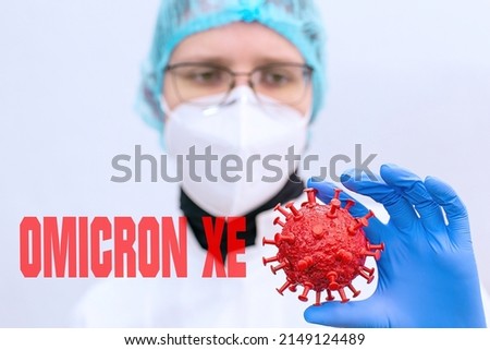 Omiсron is a new strain of coronavirus Omicron XE. Doctors or researchers studying coronovirus or developing a vaccine against o COVID-19  Royalty-Free Stock Photo #2149124489