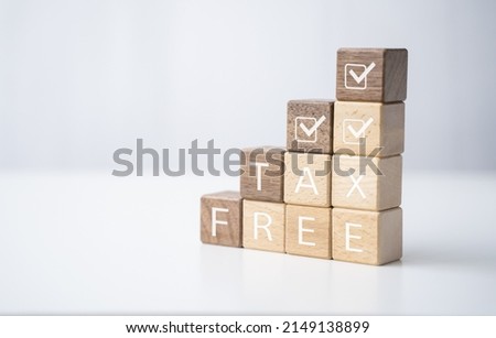 Wooden block tax free financial security bonds, check tax payment earning tax return income and expenses for individuals and business increase spending or investing for economy, with graphics icon