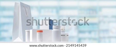 Medicines and cosmetics on the pharmacy counter, store shelves in the background Royalty-Free Stock Photo #2149145439