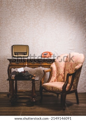 Old tv and telephone in an interior place with decoration in retro style. Royalty-Free Stock Photo #2149146091