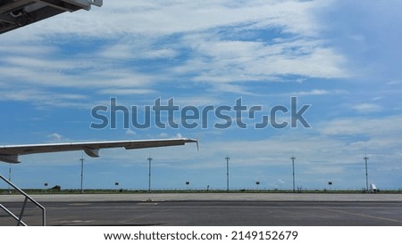 Bali, Indonesia : Picture of a part of the aircraft at the airport, wing and engine.
