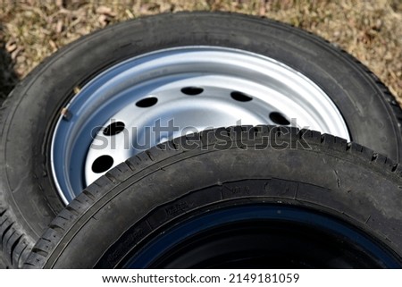 New tire with rubber on the iron disc of the car