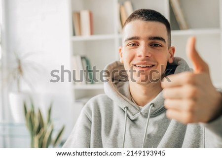 teen boy with okay and approval sign