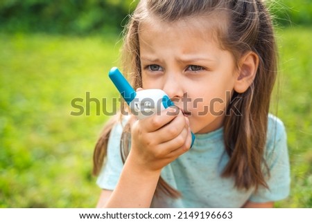 Small girl,kid play in walkie-talkie.Walkie Talkies with channels.Game of detectives, spies.Children talk,say messages at distance.Communication with parents in forest,park,hike.Finding lost people. Royalty-Free Stock Photo #2149196663