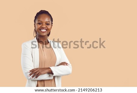 Portrait of confident young African American businesswoman isolated on orange studio background show leadership. Successful black female employee or professional. Copy space. Diversity.