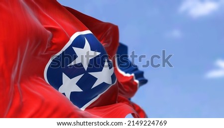 The US state flag of Tennessee waving in the wind. Tennessee is a state in the Southeastern region of the United States. Democracy and independence. Royalty-Free Stock Photo #2149224769