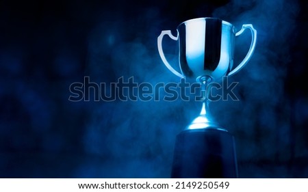Silver Trophy competition in the dark with smoke and with copy space Royalty-Free Stock Photo #2149250549