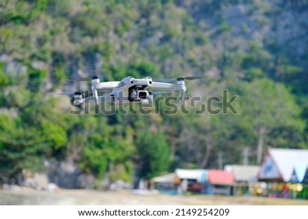 Aerial equipment Drone with Digital Camera on the mountain background.Technology concept
