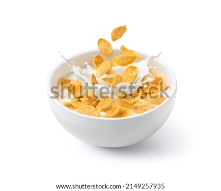 Corn flakes with milk splash in white bowl isolated on white background. Royalty-Free Stock Photo #2149257935