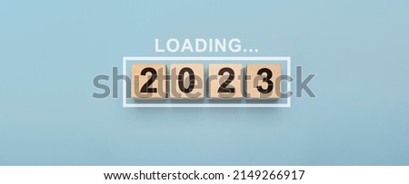 2023 New Year Loading. Loading bar with wooden blocks 2023 on blue background. Start new year 2023 with goal plan, goal concept, action plan, strategy, new year business vision. Royalty-Free Stock Photo #2149266917