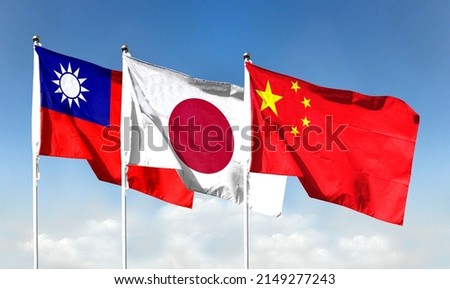 Chinese flag with blue sky and Japanese flag with Taiwan flag. waving blue sky