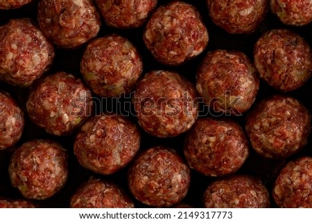 Cooking  rice meatballs or Porcupine Meatball, made with ground beef, rice, onion. Background.