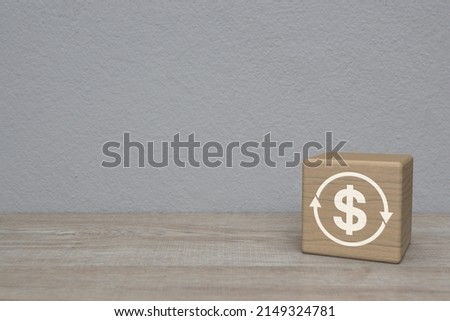 Money transfer flat icon on wood block cube on wooden table over white wall background, Business currency exchange service concept