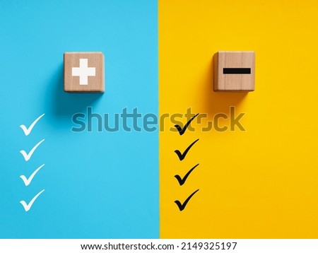 Pros and cons, things to do or not to do or strengths and weaknesses concept. Plus and minus symbols on blue and yellow background with check marks Royalty-Free Stock Photo #2149325197