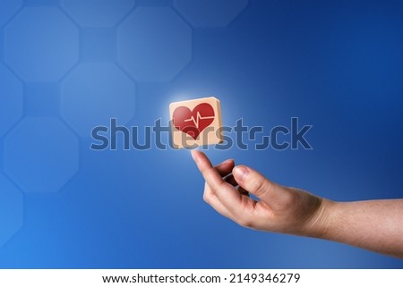 Woman hand touching medical icon heart. Health care medical solution concept. Medical technology. Health insurance.