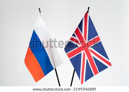 State flags of Russian Federation and United Kingdom on white background. Russia and UK conflict