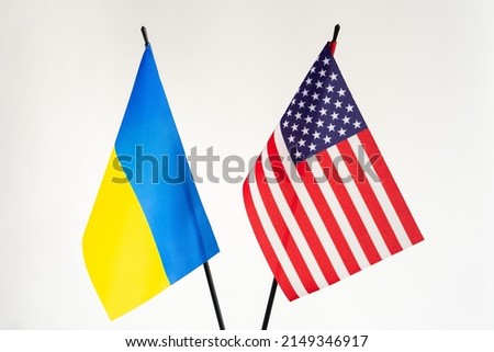State flags of Ukraine and United states of America on white background.Help in war conflict concept