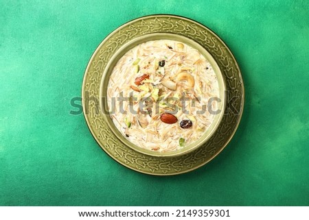 Sheer khurma or sheer khorma is a festival vermicelli pudding prepared by Muslims on Eid ul-Fitr and Eid al-Adha in Pakistan, Afghanistan, India and parts of Central Asia.  Royalty-Free Stock Photo #2149359301